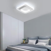 Modern bedroom with a ceiling light fixture, bed, and side table.